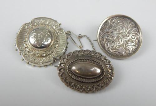 Three silver brooches