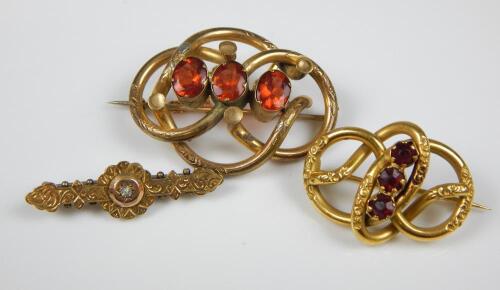 Three brooches