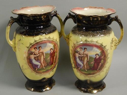 A pair of early 20thC Staffordshire pottery two handled vases