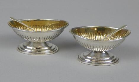 A pair of Victorian oval silver salts