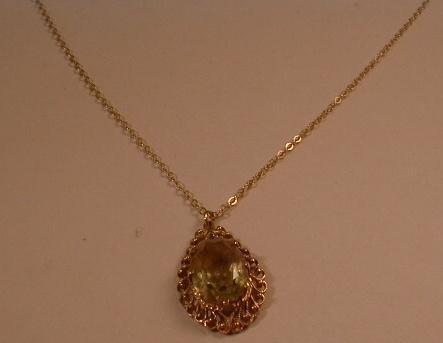 A 9ct gold pendant, tear drop shape, set with a citrine