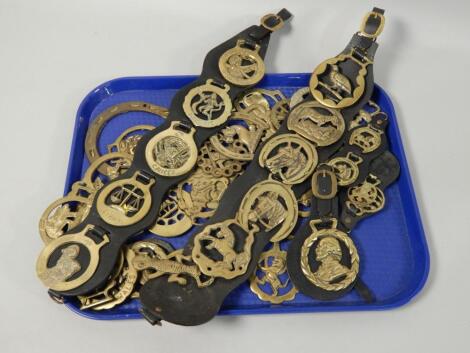 Various modern and some earlier horse brasses.