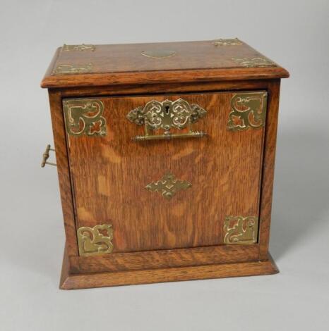 An Edwardian oak smoker's cabinet