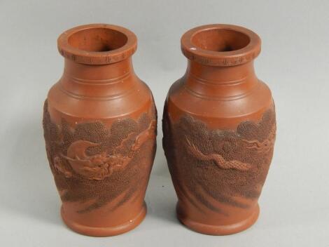 A pair of Chinese redware vases