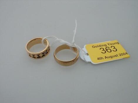 A plain 9ct gold "D" shaped wedding band and another