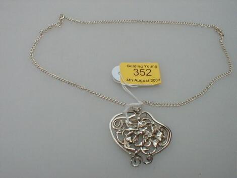 A contemporary design silver pendant on chain