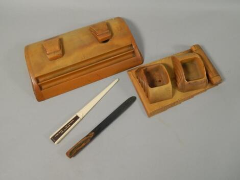 An orange Bakelite Art Deco desk set