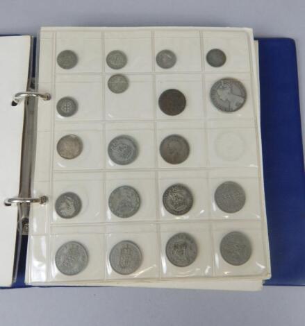 A coin album containing a number a British and Irish mainly nickel silver