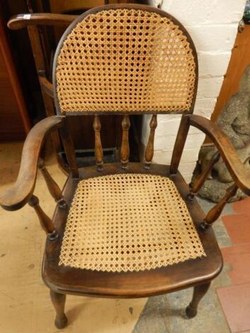 An early 20thC stained oak office type chair