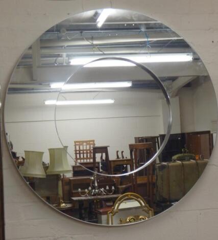 A large modern circular wall mirror