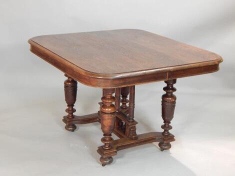 A French oak extending dining table