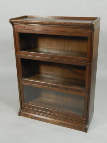 An oak Globe Wernicke type three tier bookcase made by Francis Smith