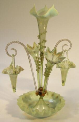 A Victorian vaseline and clear glass epergne