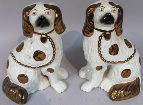 A pair of 20thC Staffordshire fireside spaniels