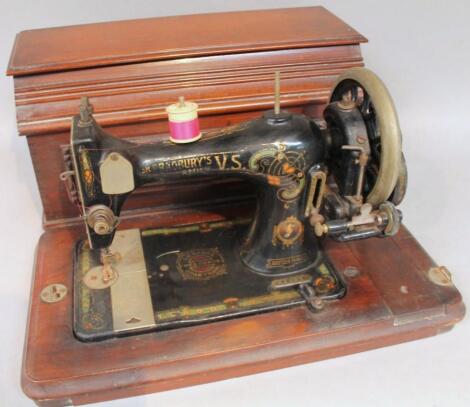 An early 20thC metal tabletop manual sewing machine