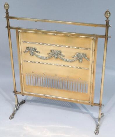 An Edwardian brass fire screen