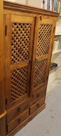 A JIG style hardwood TV cabinet