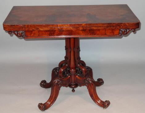 A Victorian figured walnut card table