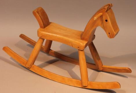 A 20thC light beech rocking horse