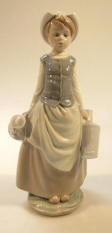 A 20thC Lladro figure of a girl