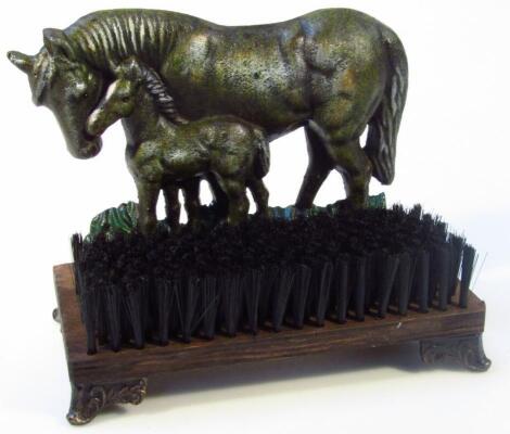 *A horse doorstop and brush.