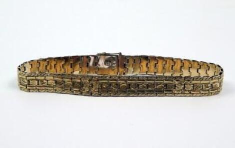 A continental yellow metal bracelet