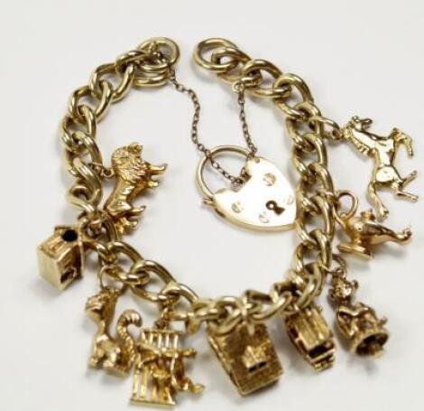 A yellow metal charm bracelet