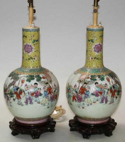 A pair of Chinese late Qing porcelain famille jaune vases