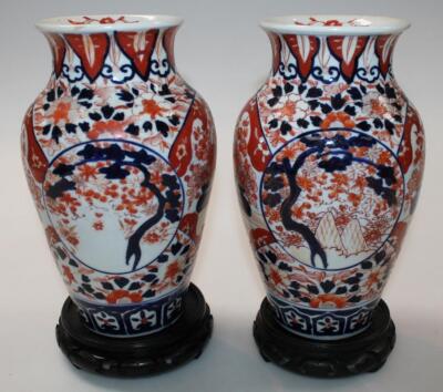 A pair of late 19thC Japanese Meiji period earthenware Imari vases