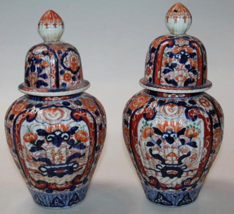 A pair of Japanese Meiji period Imari pottery vases