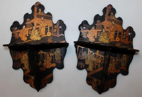 A pair of early 20thC Japanese black lacquered shelves
