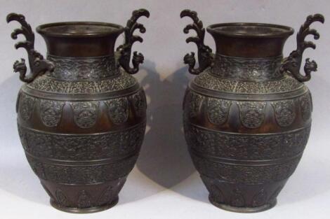 A pair of 19thC bronze vases