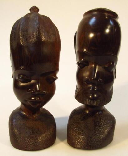 A pair of 20thC African carved tribal hardwood heads