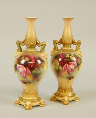 A pair of Royal Worcester porcelain two handled vases