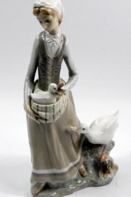 A Lladro figure of a lady and goose