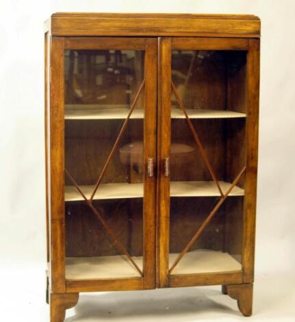 A 1920's oak display cabinet