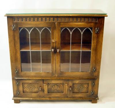 A 20thC Old Charm style low bookcase
