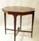 An Edwardian boxwood inlaid occasional table