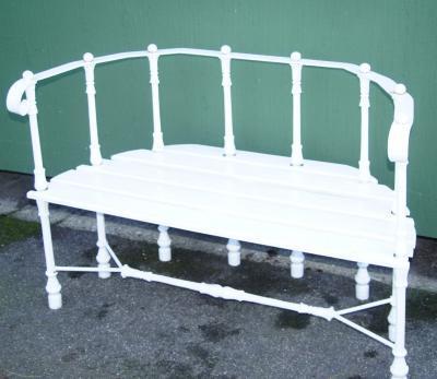 A cast iron and wooden slatted bench