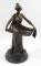 After Milo. A 20thC bronzed figure of a lady in flowing robes