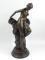 After Antio Cnova. A 20thC bronzed figure of a lady partially clothed in flowing robes