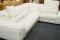 A modern white leather finish corner lounge suite.