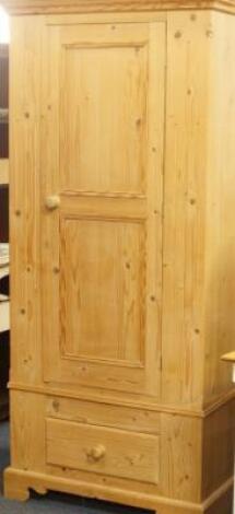 A modern pine single door wardrobe