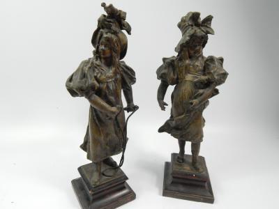 A pair of late 19thC bronze patinated spelter figures