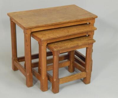 An oak nest of three tables made by Peter Rabbitman Heap