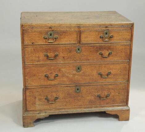 A George III oak caddy top bachelor's type chest