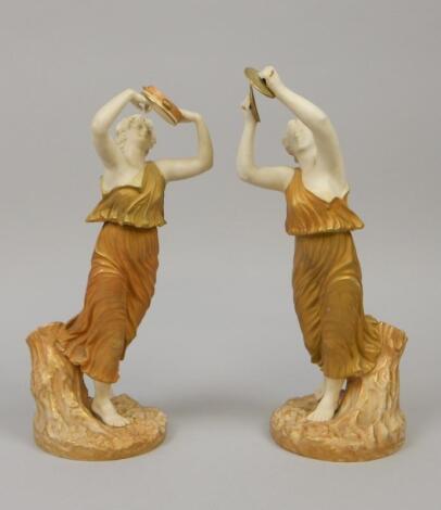 A pair of Royal Worcester porcelain figures