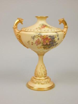 A Royal Worcester blush ivory ground two handled vase