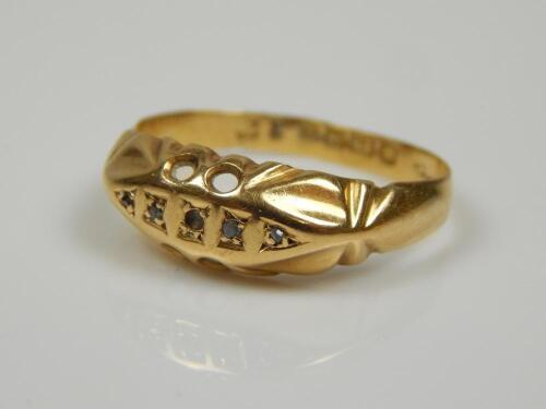 An 18ct gold gypsy ring