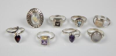 Eight modern silver dress rings